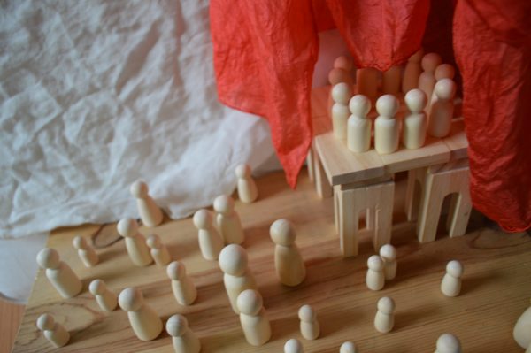 Peg dolls are set up to represent the Pentecost scene from Acts 2